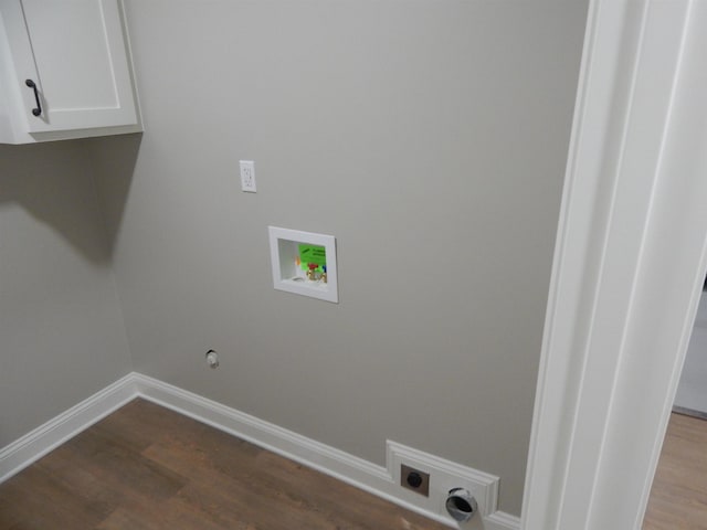 1849 Townsend Ave, Memphis, TN 38127 - washroom with washer hookup, hookup for an electric dryer, dark wood-type flooring, and cabinet space