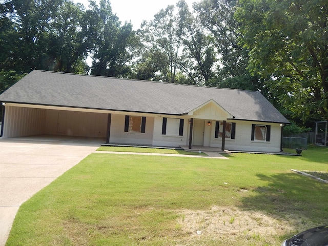 1849 Townsend Ave, Memphis, TN 38127 - view of front of house featuring concrete driveway, a porch, a shingled roof, a front lawn, and an attached carport