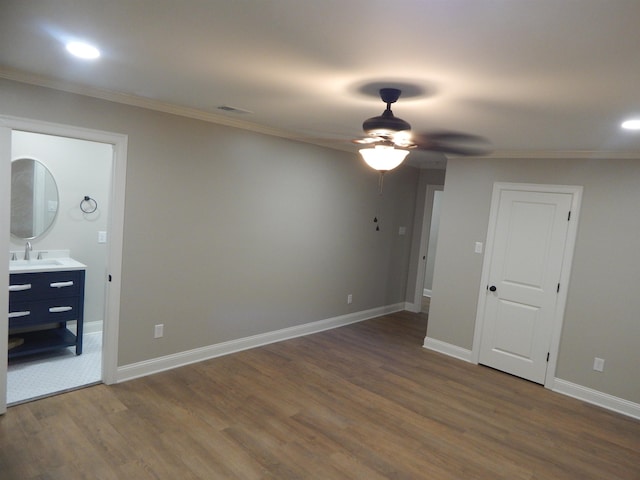 1849 Townsend Ave, Memphis, TN 38127 - unfurnished bedroom featuring crown molding, wood finished floors, recessed lighting, and ensuite bath
