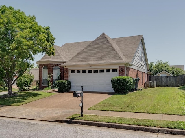2806 Misty Valley Dr, Memphis, TN 38002 - view of front of house featuring brick siding, a garage, driveway, and roof with shingles