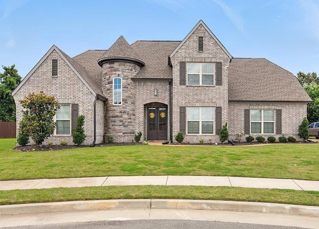 720 Woodland Fox Cv, Cordova, TN 38018 - french country inspired facade featuring a front yard, roof with shingles, and french doors