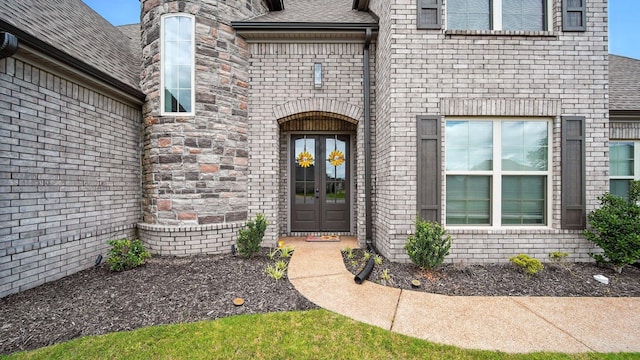 720 Woodland Fox Cv, Cordova, TN 38018 - entrance to property featuring french doors, a shingled roof, and brick siding