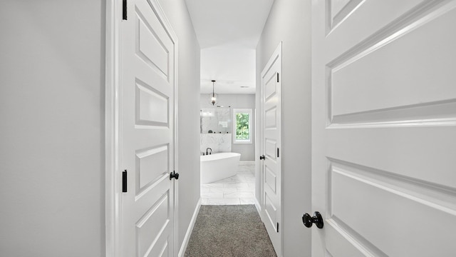 720 Woodland Fox Cv, Cordova, TN 38018 - hallway with marble finish floors and baseboards