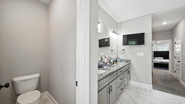 720 Woodland Fox Cv, Cordova, TN 38018 - ensuite bathroom with marble look tile flooring and double vanity