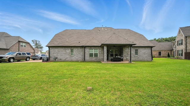 720 Woodland Fox Cv, Cordova, TN 38018 - back of property with a lawn, brick siding, a patio area, a shingled roof, and a ceiling fan