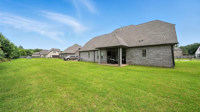 720 Woodland Fox Cv, Cordova, TN 38018 - back of house featuring a patio area, brick siding, a lawn, and a shingled roof