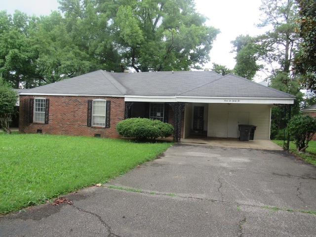 4632 Plato Ave, Memphis, TN 38128 - ranch-style home with driveway, a front yard, an attached carport, roof with shingles, and brick siding