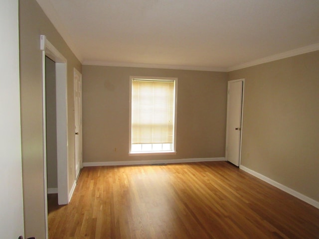 4632 Plato Ave, Memphis, TN 38128 - empty room featuring light wood-type flooring and ornamental molding