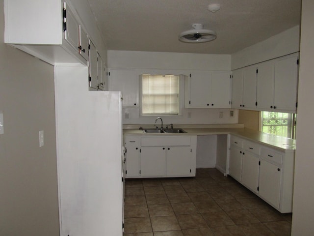 4632 Plato Ave, Memphis, TN 38128 - kitchen featuring light countertops, tile patterned flooring, and white cabinetry