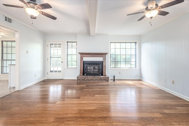2539 Kenwood Rd, Bartlett, TN 38134 - unfurnished living room featuring a ceiling fan, wood finished floors, beamed ceiling, a fireplace, and ornamental molding