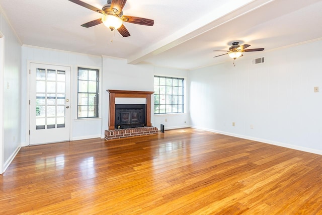 2539 Kenwood Rd, Bartlett, TN 38134 - unfurnished living room featuring ceiling fan, light wood-type flooring, a fireplace, and ornamental molding