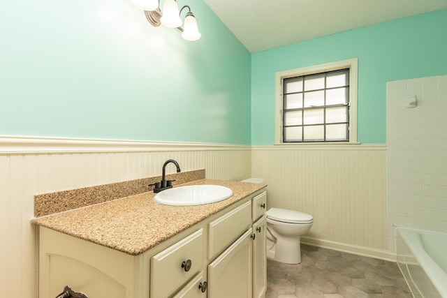 2539 Kenwood Rd, Bartlett, TN 38134 - full bath with a wainscoted wall, vanity, and shower / washtub combination