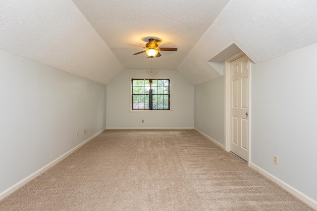 2539 Kenwood Rd, Bartlett, TN 38134 - additional living space featuring light colored carpet, ceiling fan, a textured ceiling, and lofted ceiling