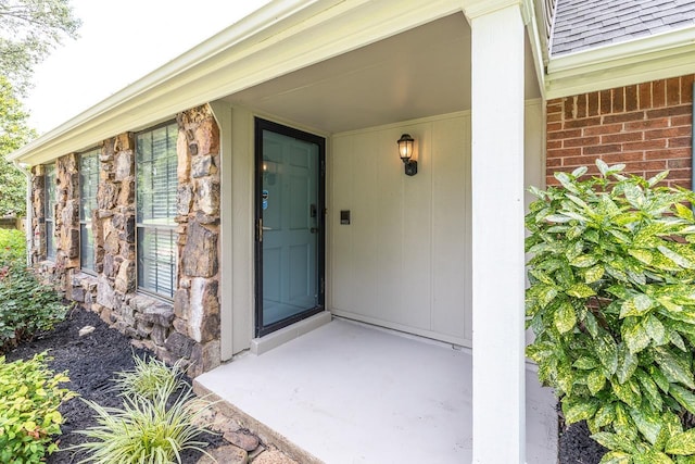 2539 Kenwood Rd, Bartlett, TN 38134 - view of exterior entry with a shingled roof and brick siding