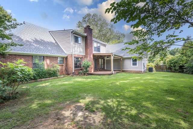2539 Kenwood Rd, Bartlett, TN 38134 - rear view of house with a chimney, roof with shingles, and brick siding