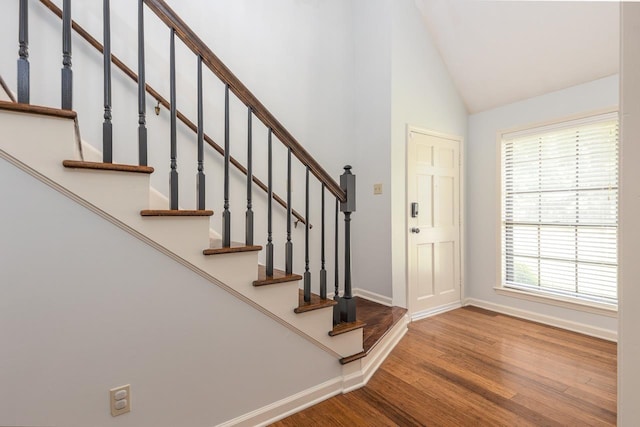 2539 Kenwood Rd, Bartlett, TN 38134 - foyer entrance featuring wood finished floors, high vaulted ceiling, and stairway