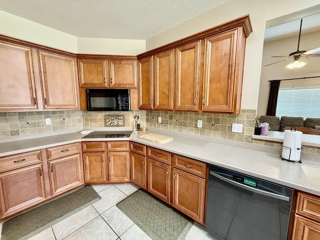 6632 W Thriveaway Cv, Bartlett, TN 38135 - kitchen with black appliances, brown cabinets, light tile patterned flooring, and ceiling fan