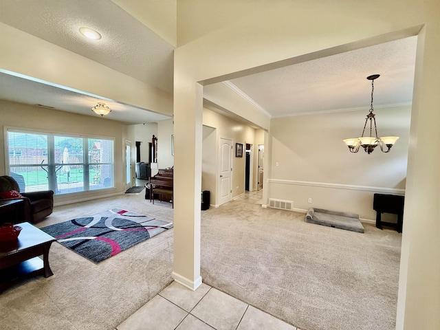 6632 W Thriveaway Cv, Bartlett, TN 38135 - living room with carpet, ornamental molding, a textured ceiling, a chandelier, and tile patterned flooring