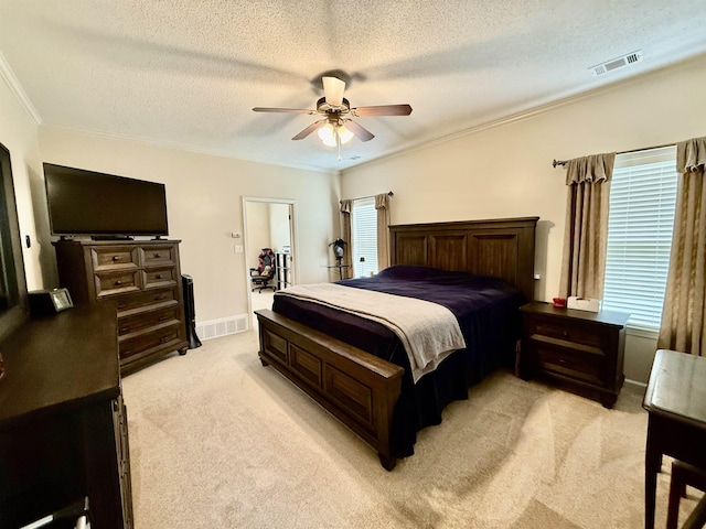 6632 W Thriveaway Cv, Bartlett, TN 38135 - bedroom with light colored carpet, ornamental molding, a textured ceiling, and ceiling fan