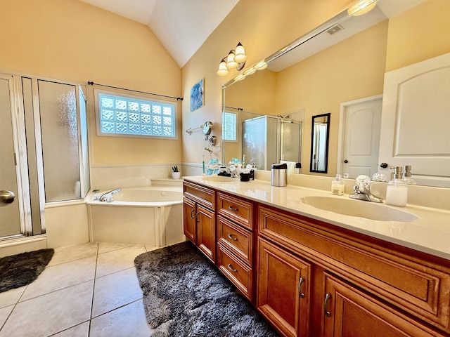 6632 W Thriveaway Cv, Bartlett, TN 38135 - bathroom featuring a stall shower, double vanity, a bath, tile patterned floors, and vaulted ceiling