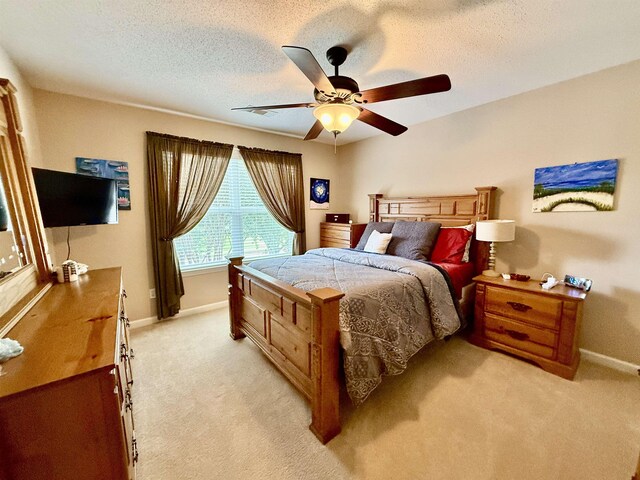 6632 W Thriveaway Cv, Bartlett, TN 38135 - bedroom featuring light carpet, ceiling fan, and a textured ceiling