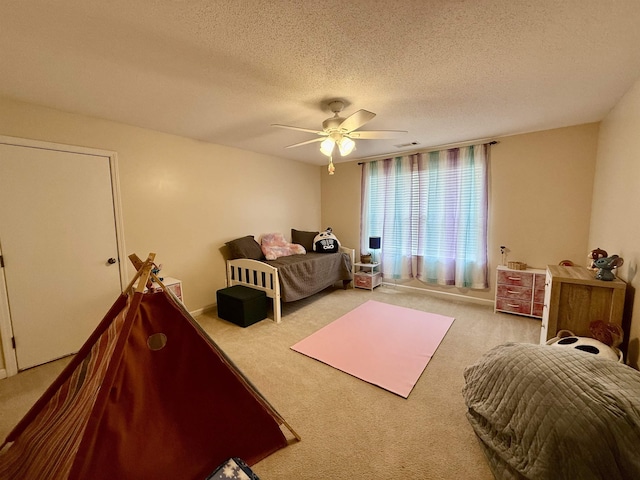6632 W Thriveaway Cv, Bartlett, TN 38135 - carpeted bedroom with a textured ceiling and a ceiling fan