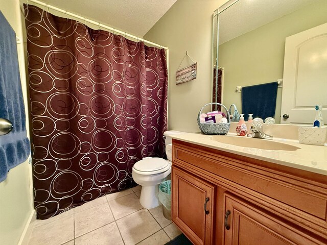 6632 W Thriveaway Cv, Bartlett, TN 38135 - bathroom featuring vanity, tile patterned flooring, a textured ceiling, and curtained shower