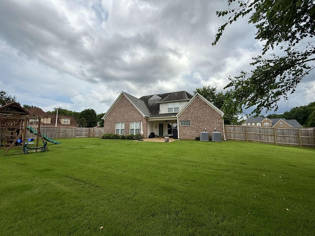 6632 W Thriveaway Cv, Bartlett, TN 38135 - back of property featuring brick siding, a fenced backyard, a playground, and a patio area