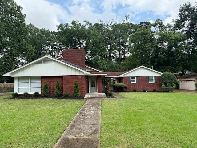 3652 Acacia St, Memphis, TN 38116 - ranch-style home featuring brick siding, a chimney, a front lawn, and board and batten siding