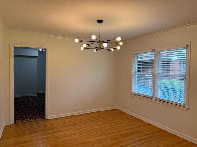 3652 Acacia St, Memphis, TN 38116 - empty room with crown molding, a chandelier, and light wood finished floors