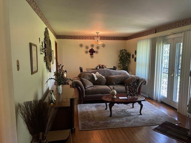 1279 Timothy Dr, Memphis, TN 38116 - living area with plenty of natural light, wood finished floors, and french doors