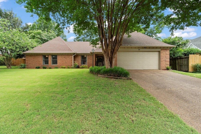 3077 Stonecrest Cir E, Lakeland, TN 38002 - ranch-style home featuring a garage, brick siding, concrete driveway, and roof with shingles