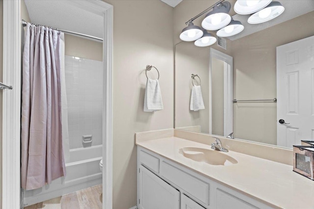 3077 Stonecrest Cir E, Lakeland, TN 38002 - bathroom with vanity, shower / bath combo with shower curtain, and wood finished floors