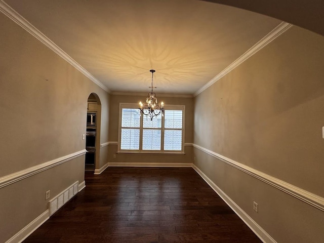 10040 Dropseed Cir, Lakeland, TN 38002 - unfurnished dining area with arched walkways, dark wood-style floors, a chandelier, and ornamental molding