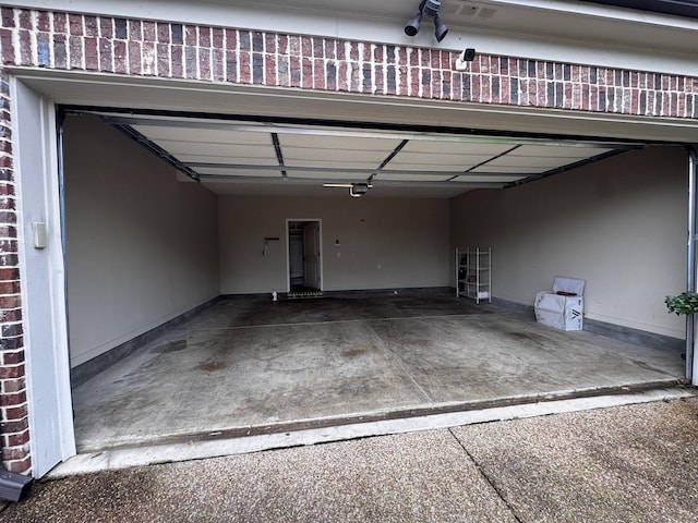 10040 Dropseed Cir, Lakeland, TN 38002 - garage featuring a garage door opener and driveway