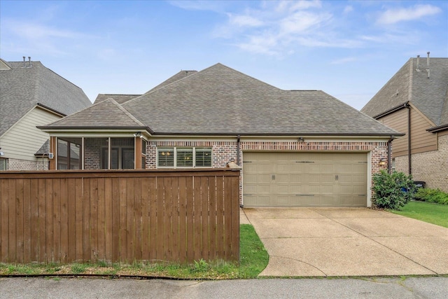 10040 Dropseed Cir, Lakeland, TN 38002 - french provincial home featuring brick siding, roof with shingles, an attached garage, and concrete driveway