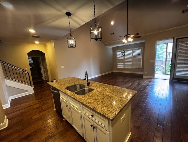 10040 Dropseed Cir, Lakeland, TN 38002 - kitchen with dishwasher, arched walkways, crown molding, open floor plan, and dark wood-style flooring