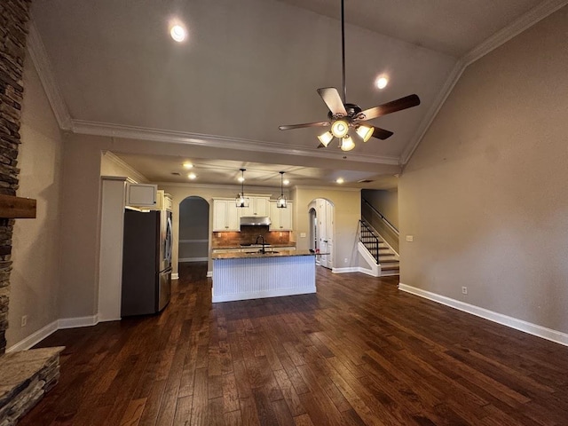 10040 Dropseed Cir, Lakeland, TN 38002 - kitchen featuring arched walkways, stainless steel fridge, ceiling fan, vaulted ceiling, and dark wood-type flooring