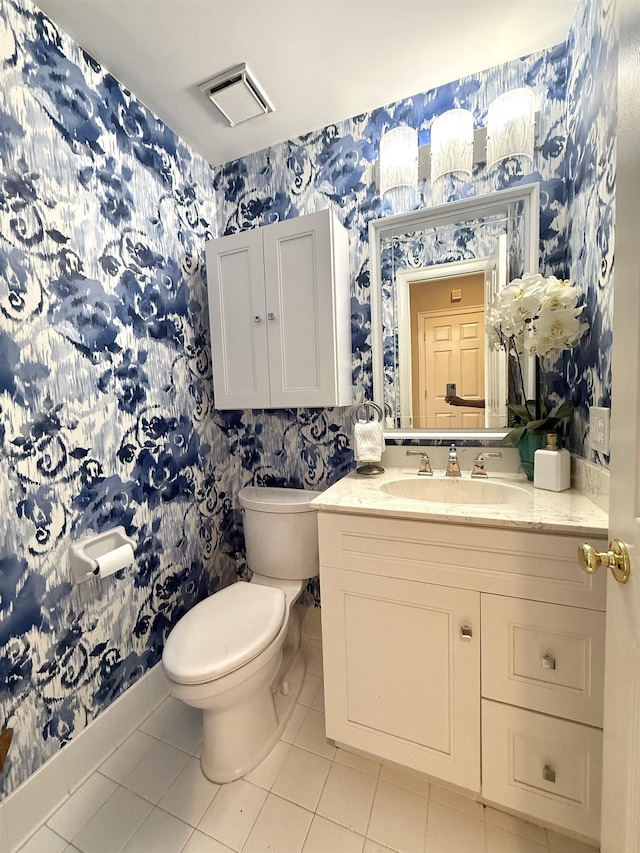 7598 Fairway Forest Dr E, Memphis, TN 38016 - half bath with wallpapered walls, tile patterned floors, and vanity