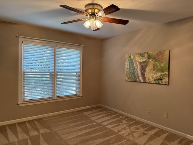 7598 Fairway Forest Dr E, Memphis, TN 38016 - carpeted empty room featuring a ceiling fan and baseboards