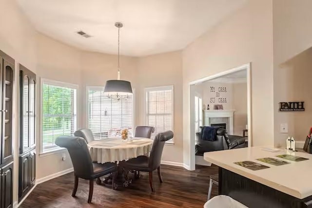 4740 Dustin Place Dr, Southaven, MS 38671 - dining area with dark wood-style flooring and a fireplace