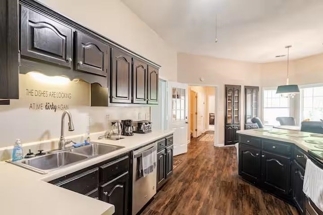 4740 Dustin Place Dr, Southaven, MS 38671 - kitchen with dishwasher, light countertops, dark wood-style floors, hanging light fixtures, and electric range oven