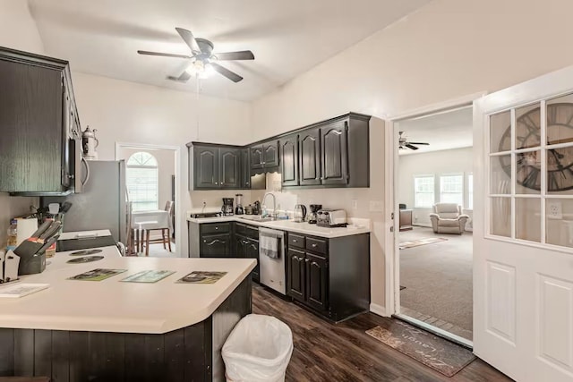 4740 Dustin Place Dr, Southaven, MS 38671 - kitchen featuring a ceiling fan, appliances with stainless steel finishes, a peninsula, and light countertops