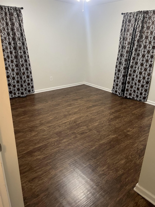 3603 Bigelow St, Memphis, TN 38127 - empty room featuring dark wood-style floors and a ceiling fan