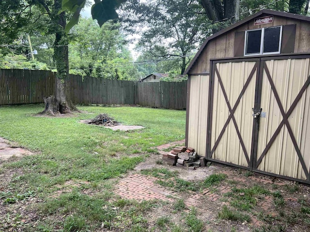 3603 Bigelow St, Memphis, TN 38127 - fenced backyard featuring a storage unit