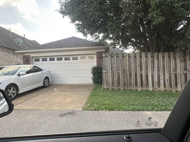 1582 Wynne Grove Dr, Cordova, TN 38016 - view of property exterior with driveway, a garage, and brick siding