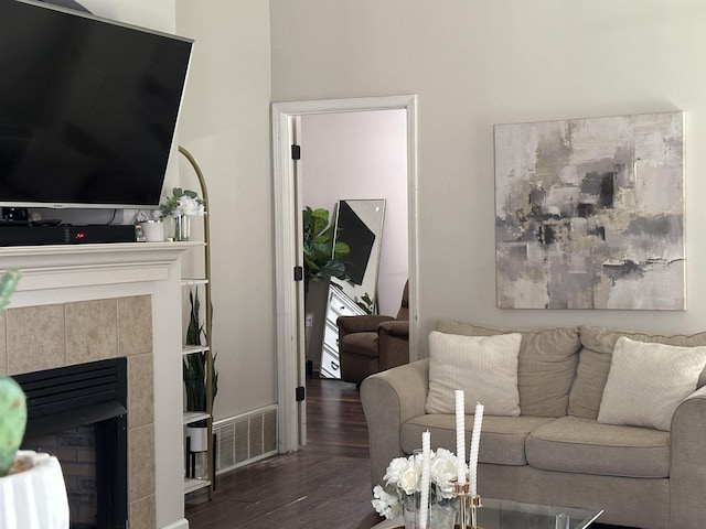 1582 Wynne Grove Dr, Cordova, TN 38016 - living area with wood finished floors and a tiled fireplace