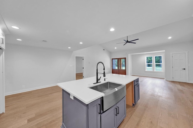 9700 N Helene Cv, Millington, TN 38053 - kitchen with open floor plan, light countertops, recessed lighting, light wood finished floors, and a center island with sink