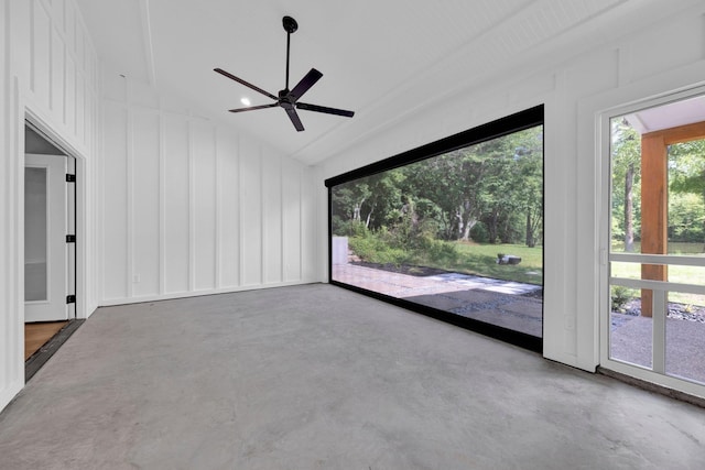 9700 N Helene Cv, Millington, TN 38053 - empty room with ceiling fan, concrete floors, a decorative wall, and lofted ceiling