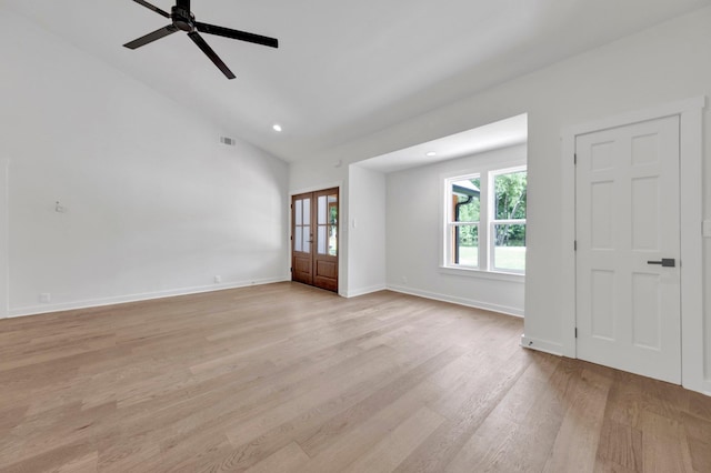 9700 N Helene Cv, Millington, TN 38053 - unfurnished living room with light wood-style flooring, ceiling fan, recessed lighting, high vaulted ceiling, and french doors